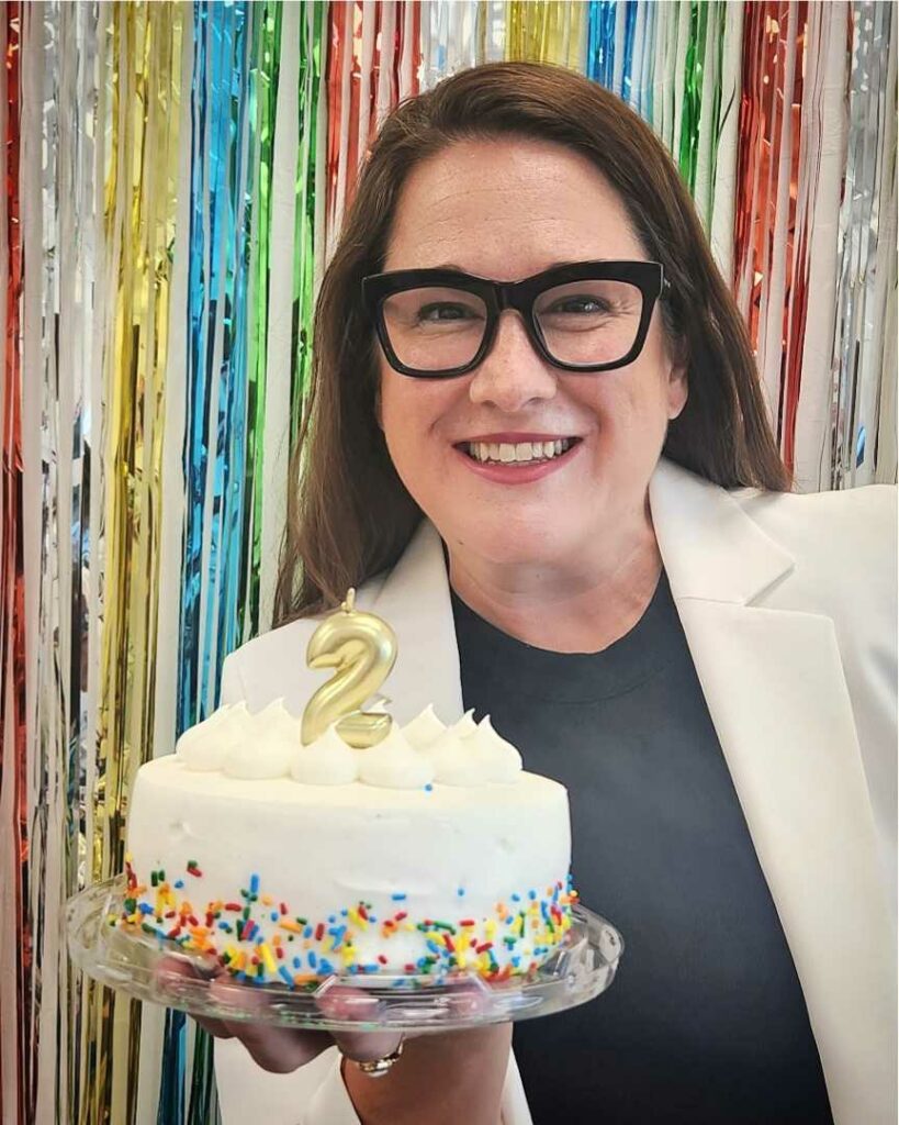 Lindsey Miller holding a birthday cake