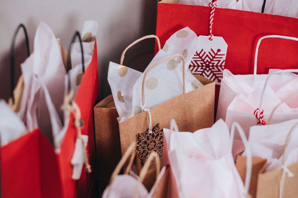 A bunch of red and brown shopping bags for the holidays